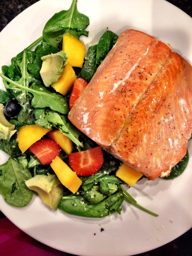 Wild caught, fresh salmon. Spinach salad with blueberries, strawberries, mango, avocado and a citrus dressing. Yum.